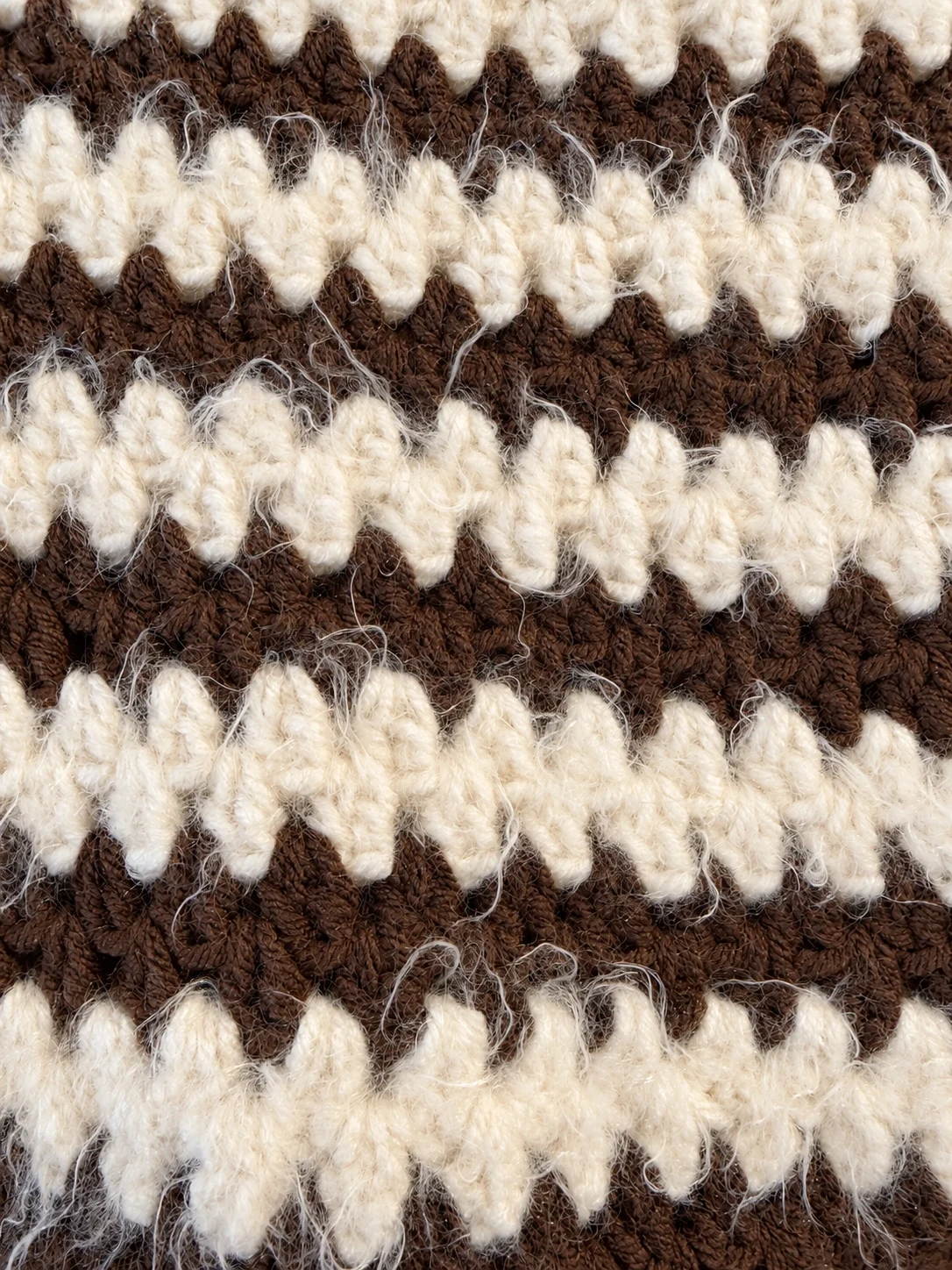 Close-up of the textured cocoa brown and warm cream stitches on the Cocoa Stripe Cotton Pullover