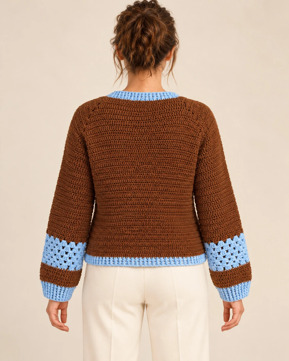 Model wearing the Chestnut & Sky Crochet Cardigan from the back