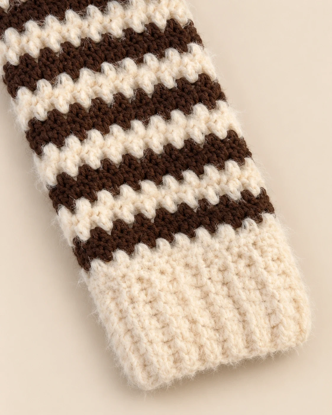 Close-up of the wide warm cream cuff and striped sleeve on the Cocoa Stripe Cotton Pullover