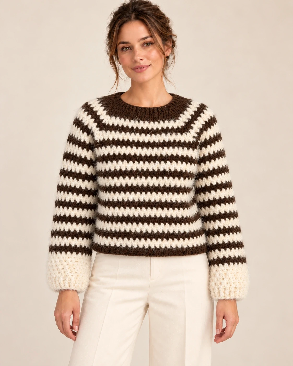Model wearing the Cocoa Stripe Cotton Pullover, front view showing its cropped shape and cream cuffs
