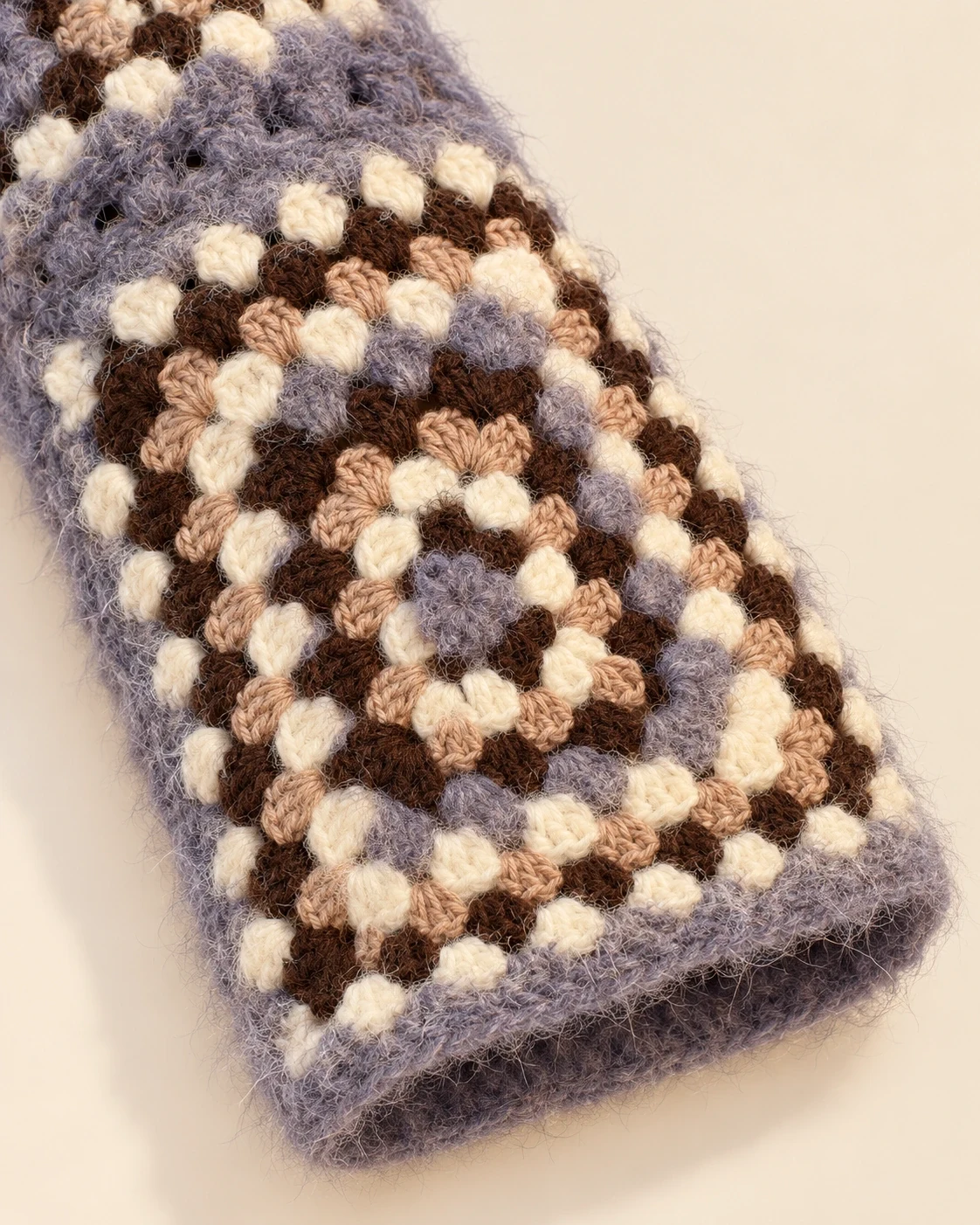 Sleeve detail of the Lavender Granny Square Cotton Cardigan showing crochet motifs and the lavender cuff edge