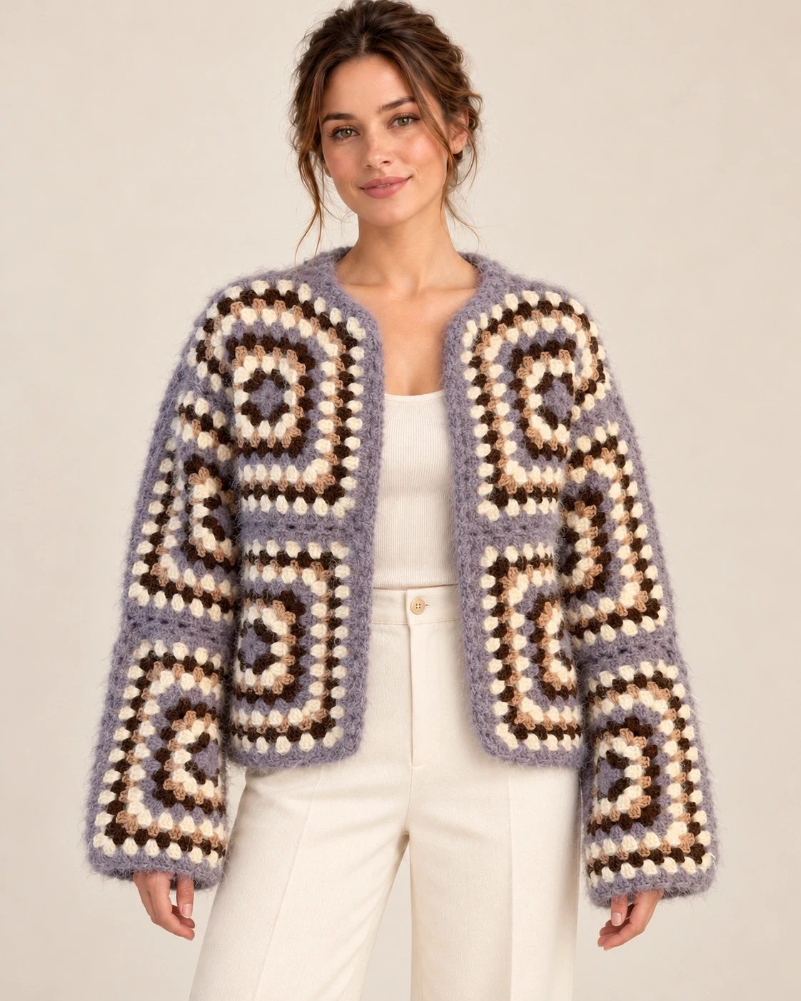 Model wearing the Lavender Granny Square Cotton Cardigan, front view showing its open front and cropped shape