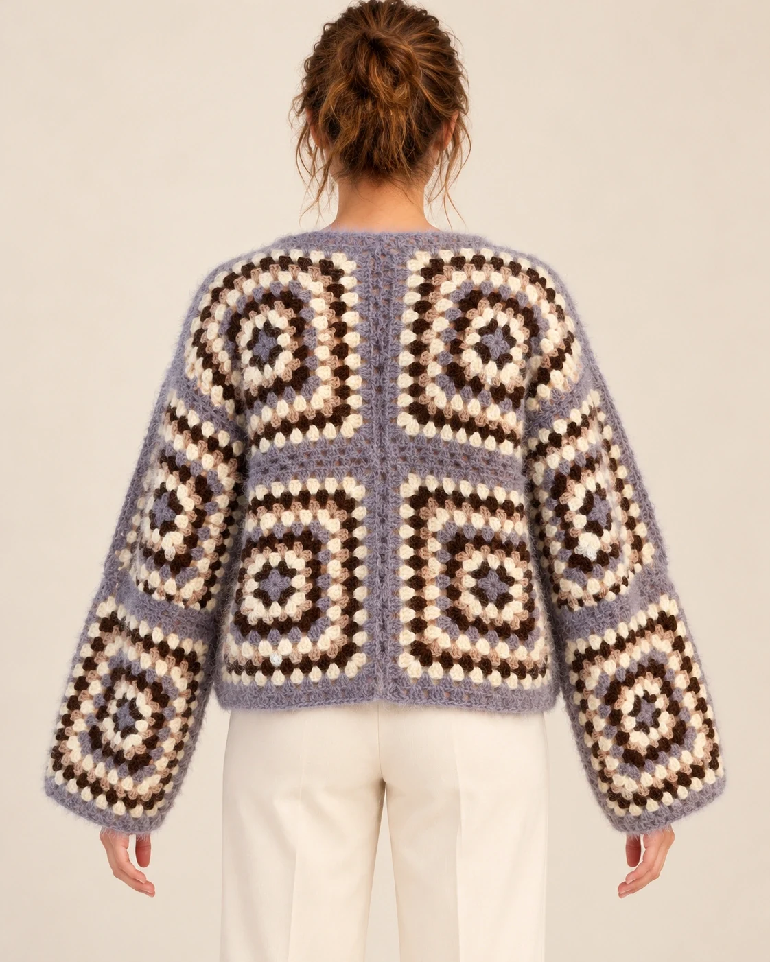 Model wearing the Lavender Granny Square Cotton Cardigan, back view showing its granny square pattern and cropped length