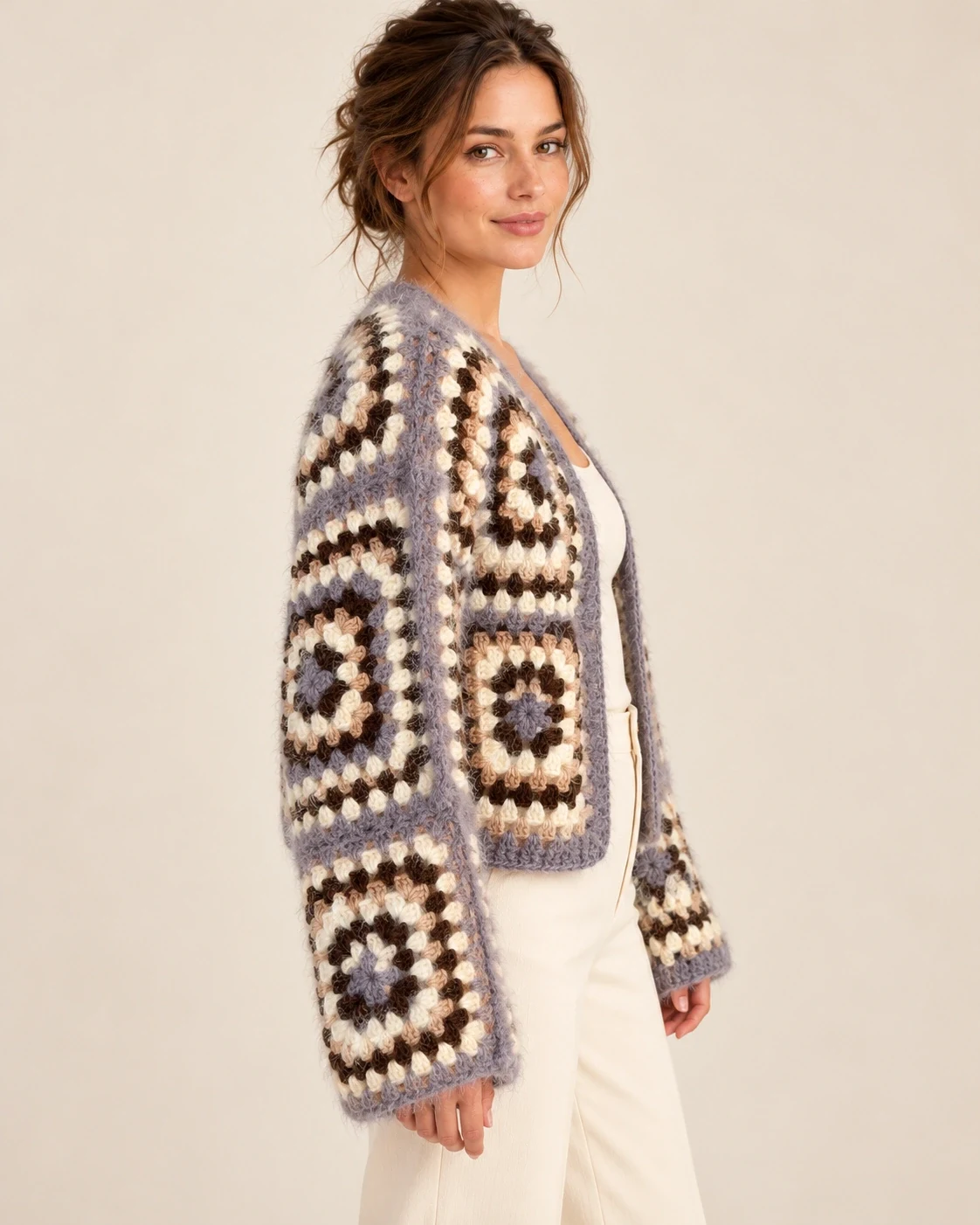 Side view of a model wearing the Lavender Granny Square Cotton Cardigan, showing relaxed long sleeves and lavender edging